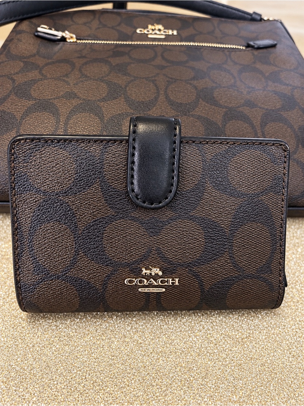 Coach Brown and Black Signature wallet & bag set.